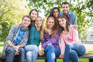 Group portrait of young college students in the park